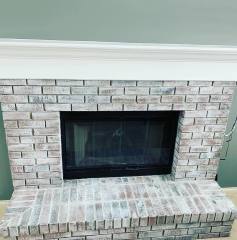 After whitewashing a brick fireplace by Pro Finish Painting and Drywall from Chagrin Falls, Ohio